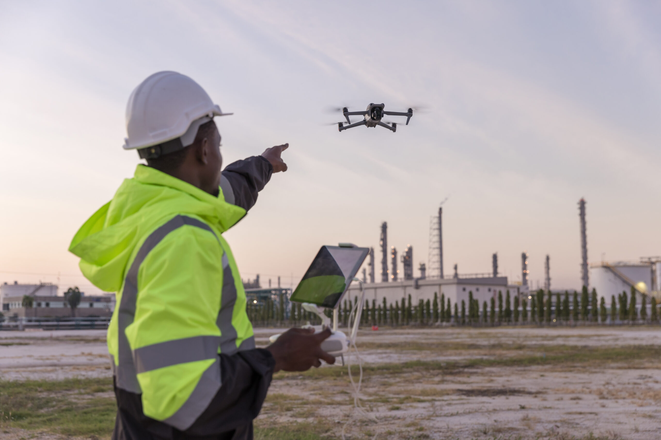 Engineer surveyor team Use drone for operator inspecting and survey construction site. Surveyors or explorer use drones to view construction sites or check security